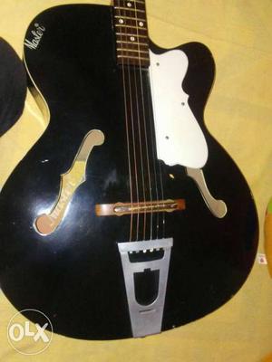 Black acoustic guitar in best condition