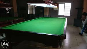 Brown Wood Frame And Green Mat Pool Table