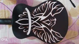 Concord's Indonesian made baby guitar, with guitar art on