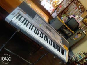 Gray Electric Keyboard With Stand