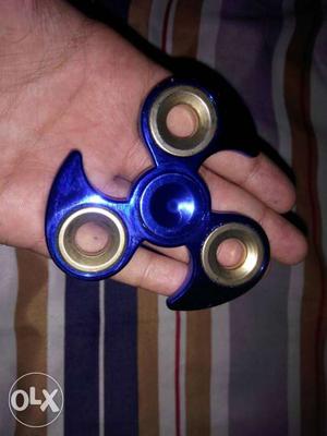 It is a metal fidget spinner and is in anew