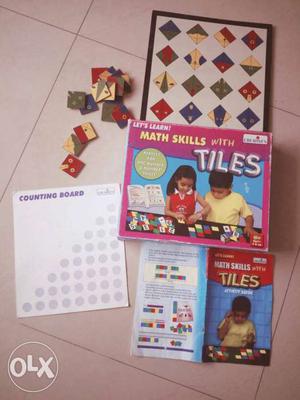 Math Skills With Tiles Board Game Box, and wooden check