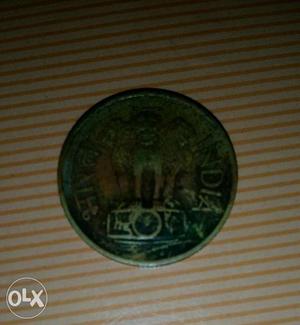 Round coin of 20 paise year 