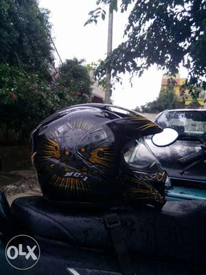 Black, Brown, And Gray Motocross Helmet