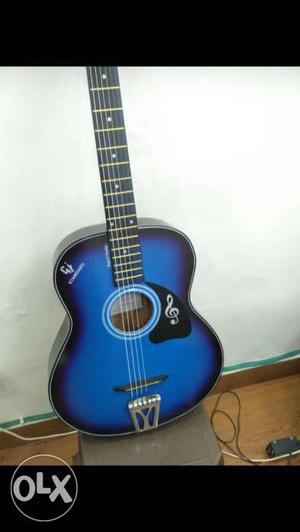 Black and blue acoustic guitar, nice design and