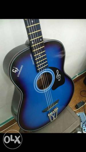 Blue and black pure acoustic guitar, side design