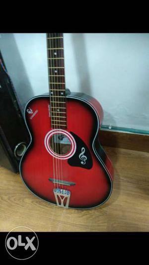Red and black pure acoustic guitar, hollow body
