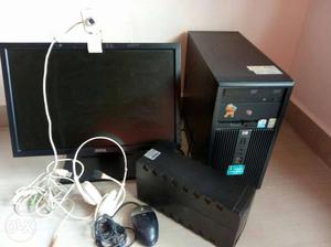 Black Dell Computer Monitor With Computer Tower And Mouse