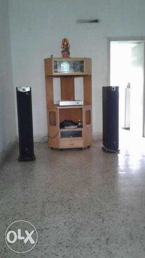 Brown Wooden TV Hutch And Two Black Speakers