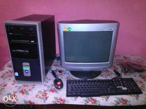 Grey CRT Monitor With Computer Tower And Cored Keyboard And