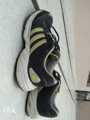 Pair Of Black-white-and-yellow Adidas Mid Top Sneakers
