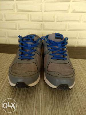 Pair Of Gray-and-blue Nike Sneakers