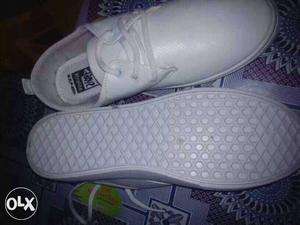 Pair Of White Low Top Shoes