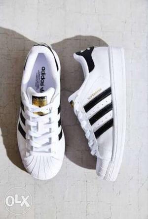 Pair Of White-and-black Adidas Sneakers