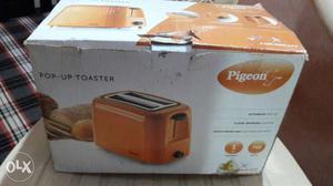 Pigeon brand bread toaster (orange colour)