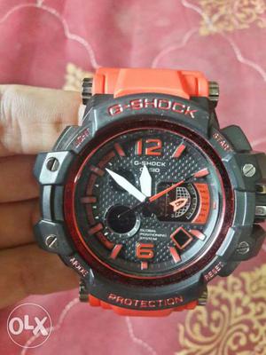 Round Black And Orange Casio G-Shock Chronograph Watch With