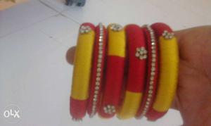 Six Yellow-and-red Threaded Bangles