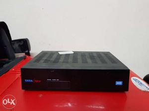 Tata sky HD set top box with remote control.