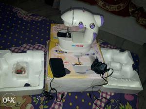 White And Purple Sewing Machine with box 1 month old