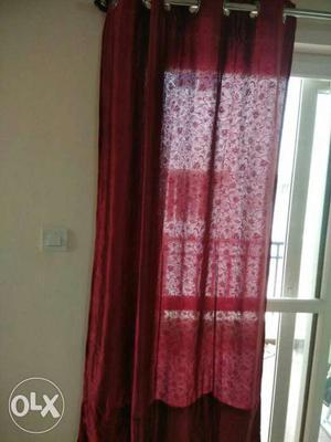 4 pieces of door curtains in maroon colour.