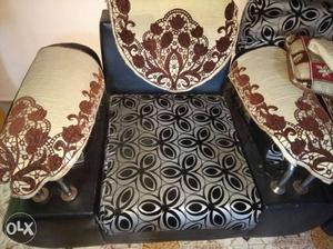 Black And Gray Leather Sofa Chair With Brown Floral Mantel