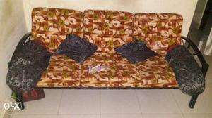 Black Steel Frame Sofa Bed With Throw Pillows