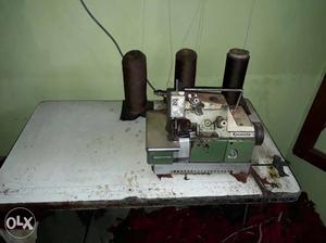 Green And Gray Eletric Sewing Machine