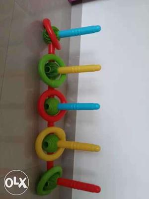 Multicoloured ring throwing aiming game