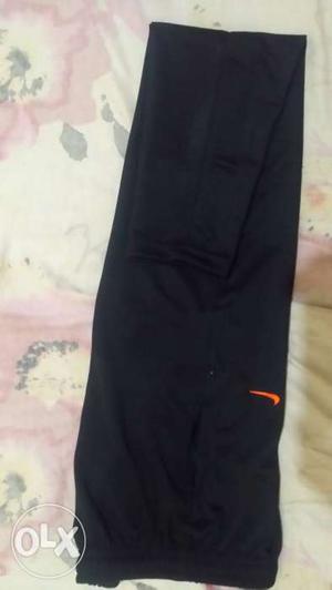 Nike L size black color track pants. New and