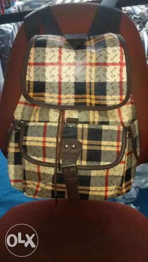White, Gray And Black Plaid Backpack