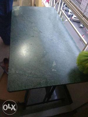 A very strong granite dining table of size 2 1/2