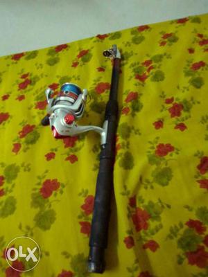 Black, White, And Blue Fishing Rod