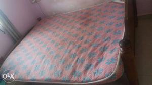 Brown Wooden Bed Frame With Pink And Grey Floral Bed