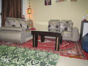 Four Seater split compact urban sofa with table.