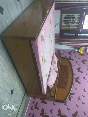 Pink And Brown Floral Mattress With Brown Wooden Bed
