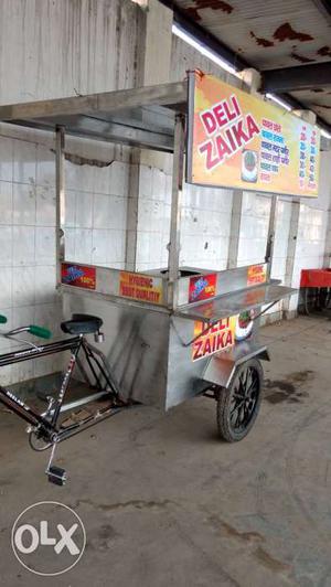 Silver-colored Deli Zaika Food Stall