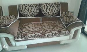 White And Brown Padded Sofa