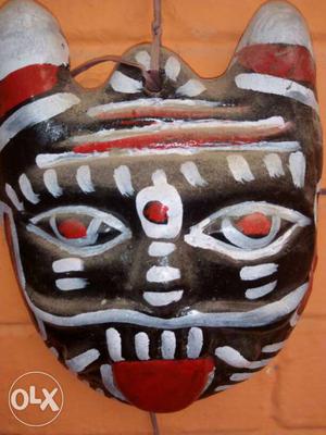 White, Red, And Black Tribal Mask Decor