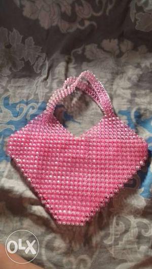 A pink crystal bag for party use