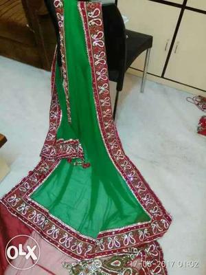 Designer heavy wedding sari. Red colour.