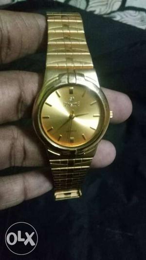 Golden colour watch Oman gift