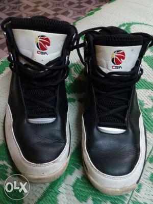 Pair Of Black-and-white Leather CSA Basketball Shoes