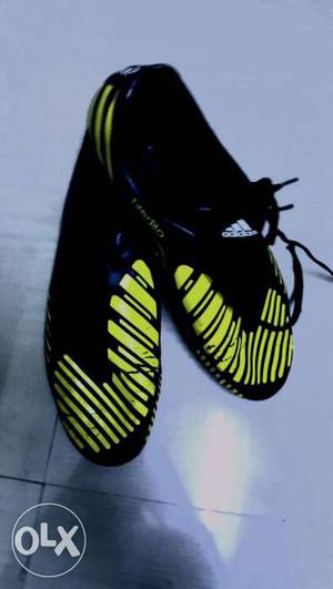 Pair Of Black-and-yellow Adidas Athletic Shoes