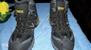 Pair Of Black-and-yellow sefty Shoes