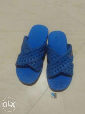Pair Of Blue Slide Sandals