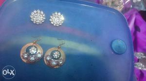 Pairs Of Silver Diamond Encrusted Earrings