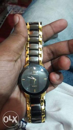 Quartz watch black and golden contact me in