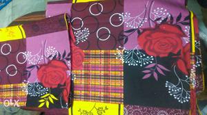 Red, Black, Yellow, And Pink Floral Textile