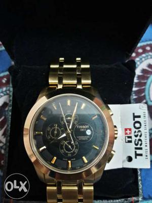 Round Gold Tissot Chronograph Watch With Gold Band