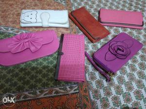 Six Purple, Pink, Brown, And White Leather Long Wallets